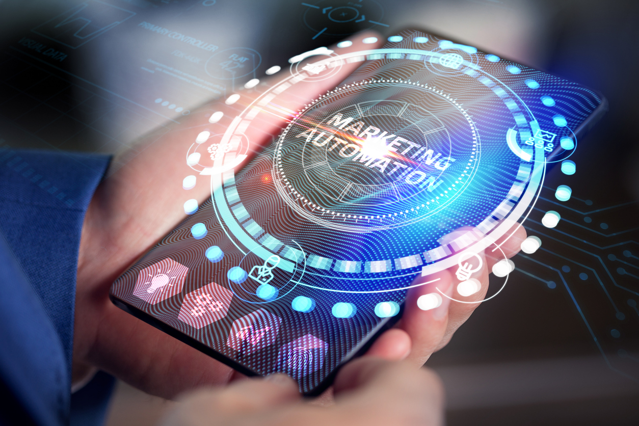 Planning marketing strategy. Business, Technology, Internet and network concept. Young businessman shows the word: Marketing automation. Can SEO be automated?