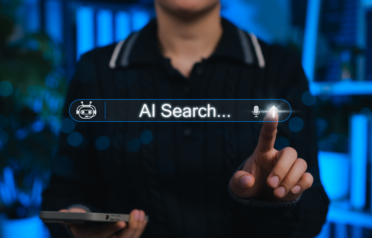 Person analyzing AI-powered search results and SEO performance on a computer.