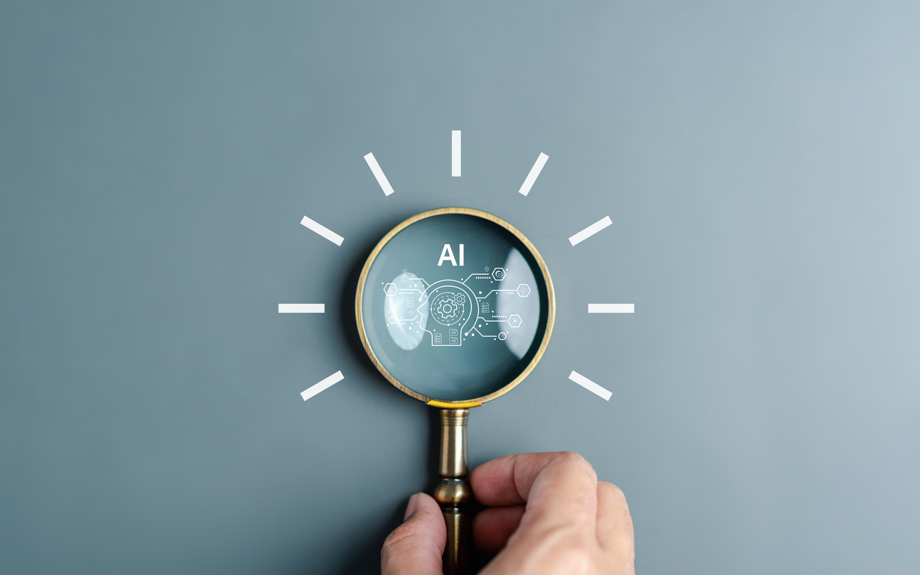Small business owner reviewing AI search results and optimizing a website for Google AI Overviews and ChatGPT.